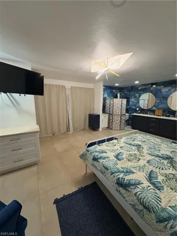 Bedroom with an inviting chandelier