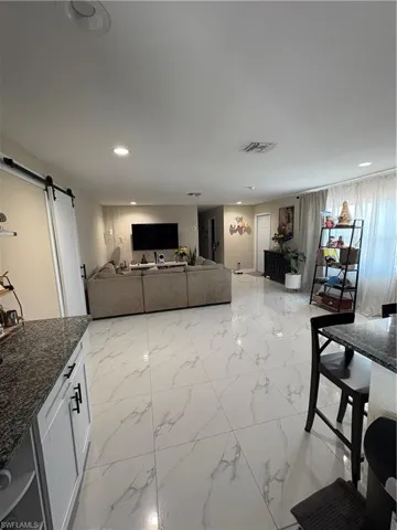Living room with a barn door