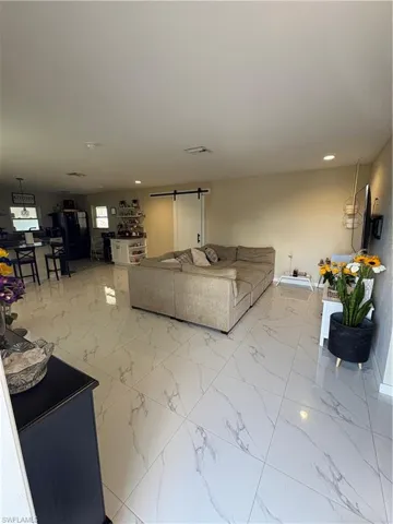 Living room featuring a barn door