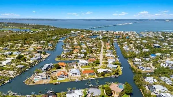Drone / aerial view featuring a residential view and a water view