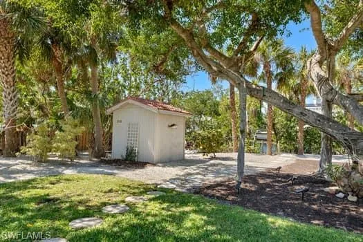 View of yard featuring an outbuilding and a storage unit
