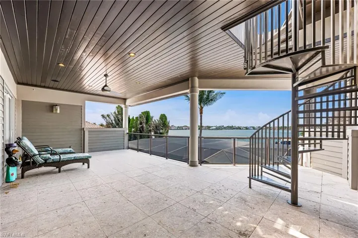 2nd floor lanai featuring a water view and stairs to 3rd floor lanai