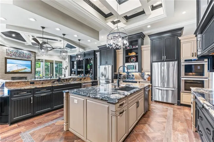 Kitchen with coffered ceiling, 2 refrigerators, 2 freezers, 2 dishwashers, induction cooktop, microwave