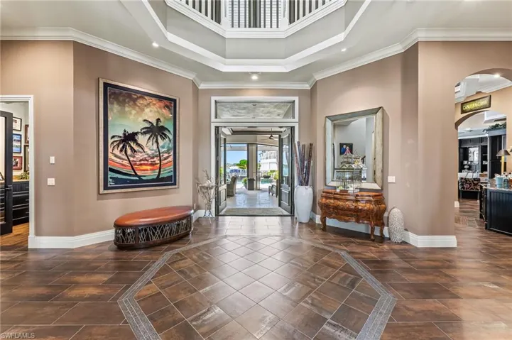 Entrance foyer featuring a high ceiling