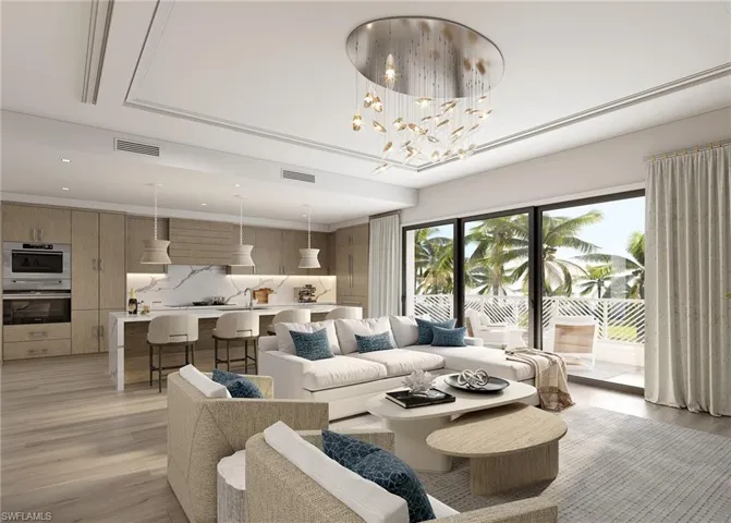 Living room featuring light wood-style flooring and a chandelier