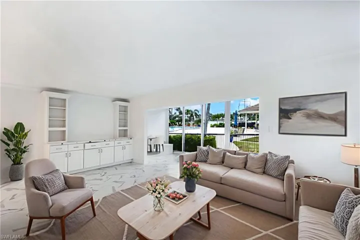 Virtually staged to show furniture options-living room & Florida room