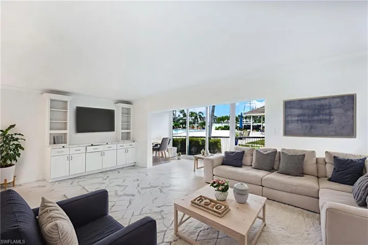 Virtually staged to show furniture options-living room & Florida room