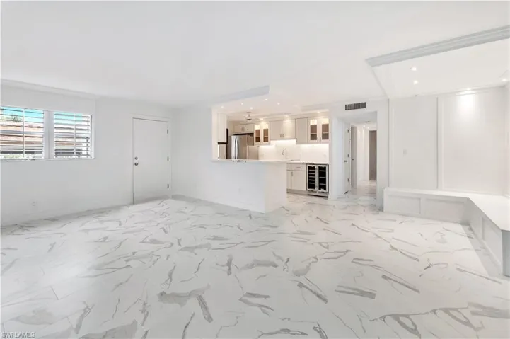 The dining area features built-in seating & specialty lighting