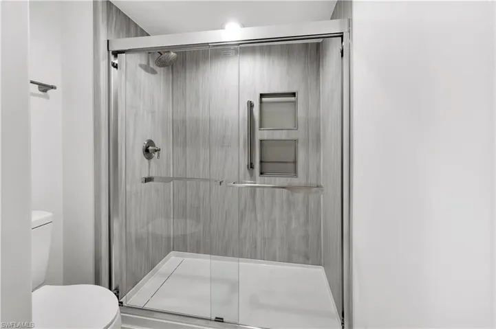 Built-in shower niches, grab bars & specialty drain system