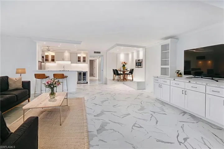 Virtually staged to show furniture options-living room, dining & breakfast bar