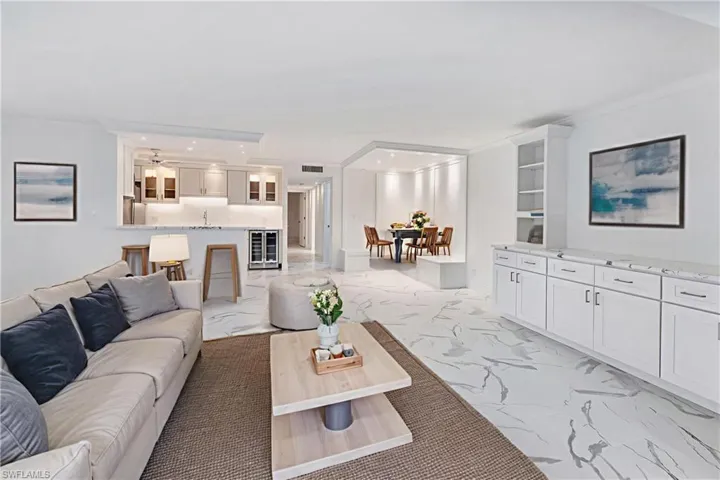 Virtually staged to show furniture options-living room, dining & breakfast bar