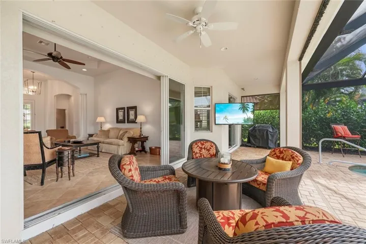 View of patio / terrace featuring a ceiling fan, area for grilling, an outdoor living space, and new outdoor TV