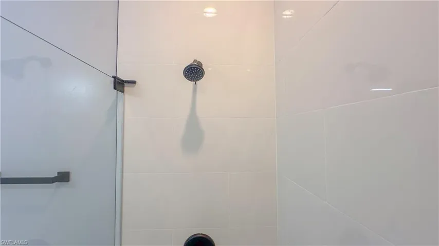 Full bath with tiled shower