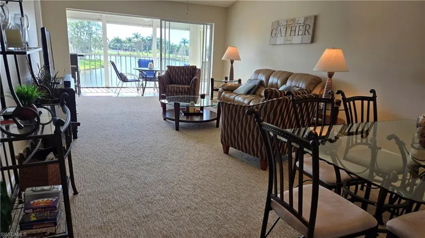 Open and airy living room overlooking lake and golf course
