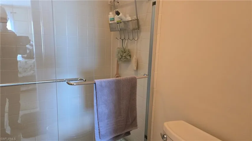 Walk-in shower adjoins primary bedroom