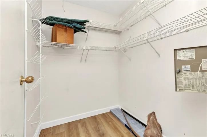 Walk in closet featuring light wood-style flooring