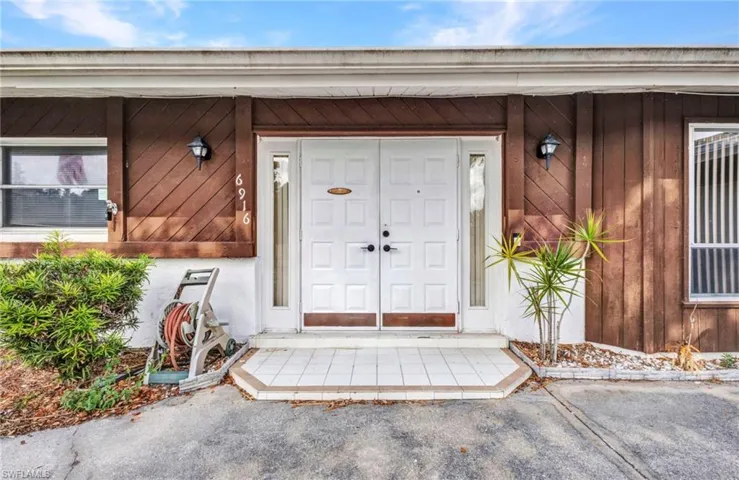 Entrance to property with board and batten siding