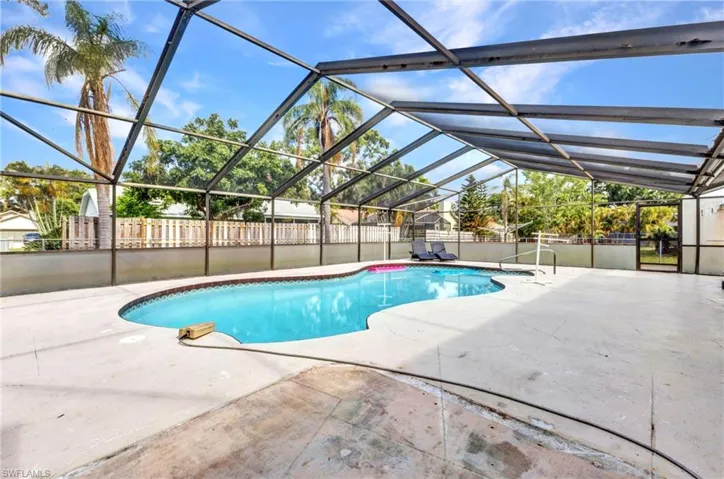 View of pool featuring a patio area and a lanai