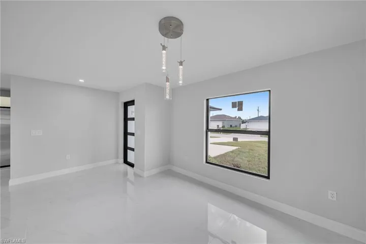 Spare room featuring recessed lighting and marble finish floors