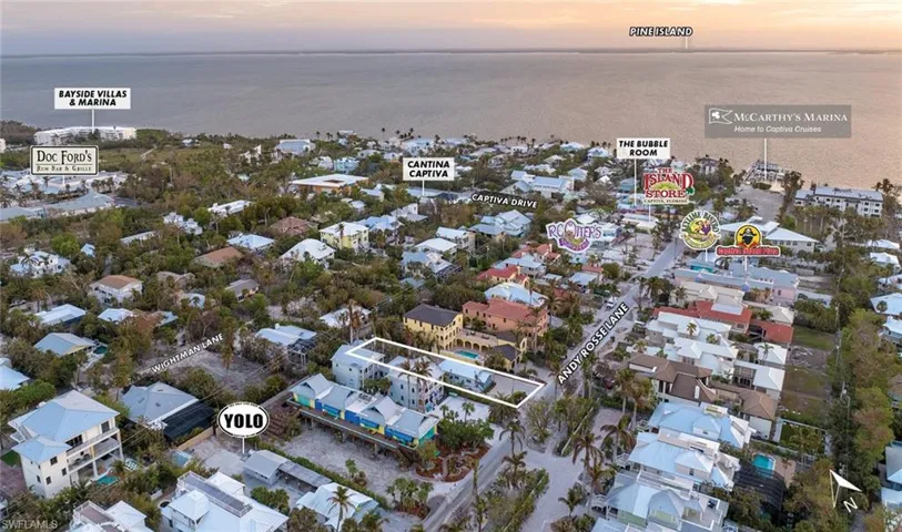 Aerial view at dusk featuring a water view