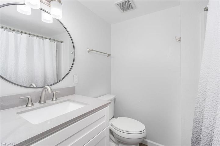 Updated bathroom with new vanity, lighting & pluming fixtures