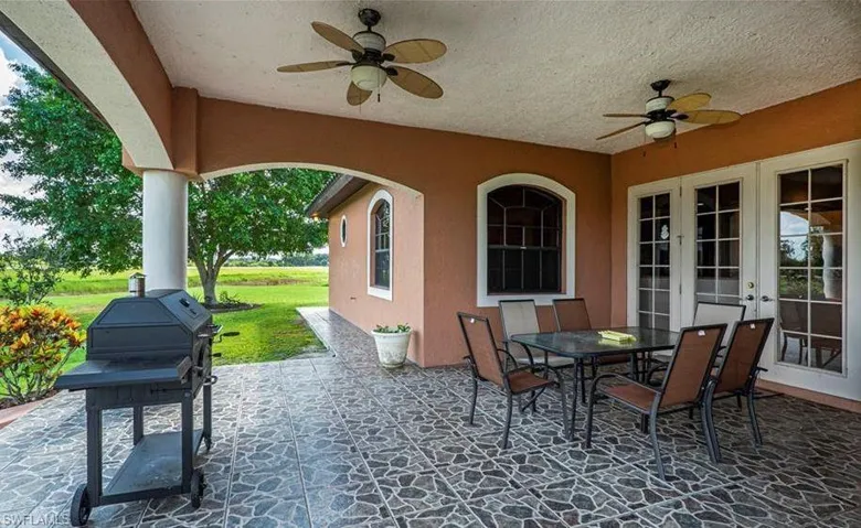 View of patio featuring ceiling fan and french doors