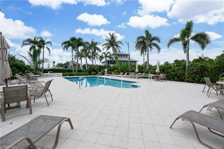 Community pool with a patio area