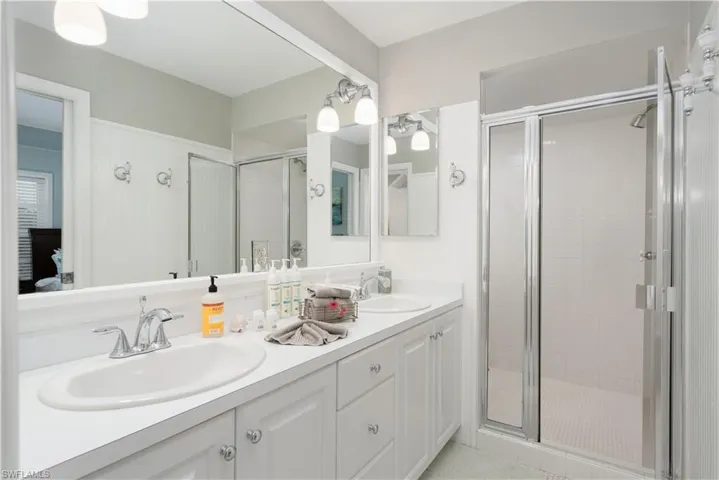 Full bathroom with a shower and double vanity