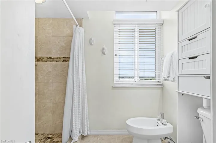 LARGE WALK-IN SHOWER AND ADDED BIDET.