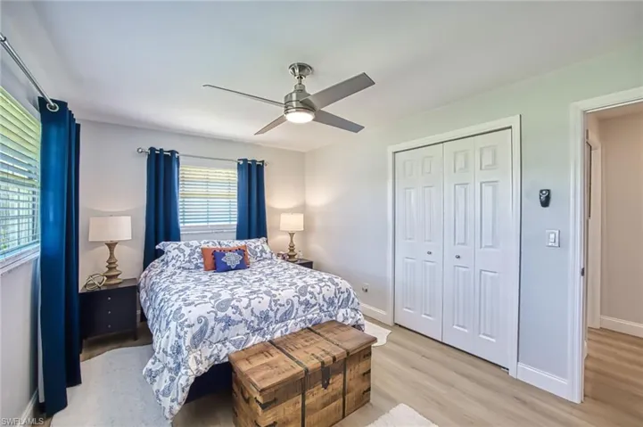 Guest Bedroom with a closet, and light wood-style flooring