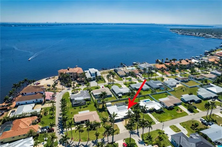 Drone / aerial view featuring a residential view and a water view