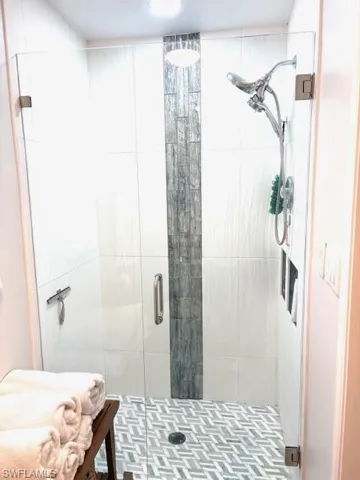 Full bath with a shower stall