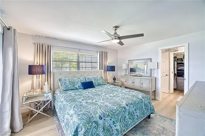 Master Bedroom with light wood-type flooring.