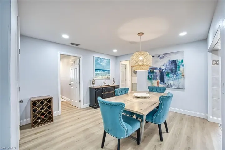 Dining area featuring recessed lighting and light wood finished floors
