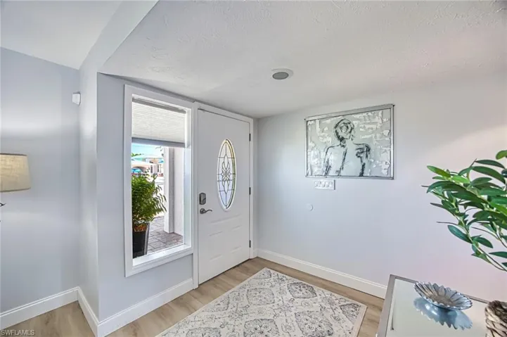 Foyer featuring light wood-style flooring