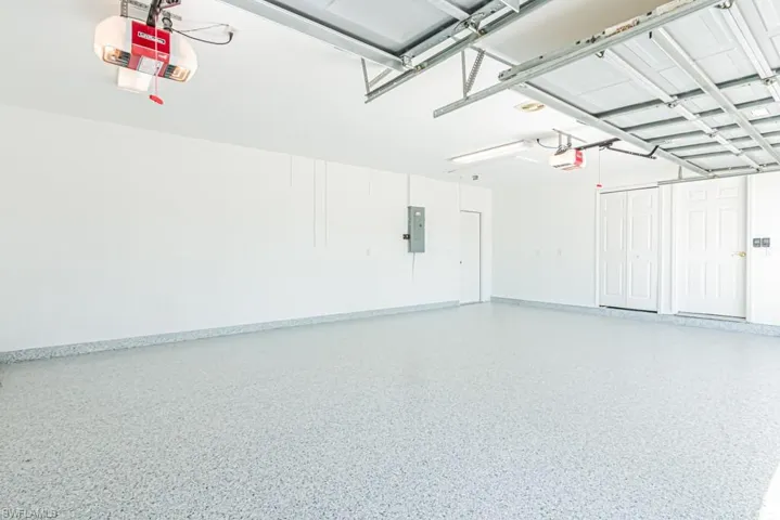 Three car garage newly painted and Epoxy floor.