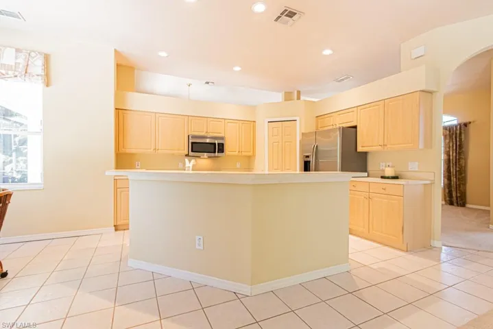 Open Kitchen with new GE Profile range and dishwasher.