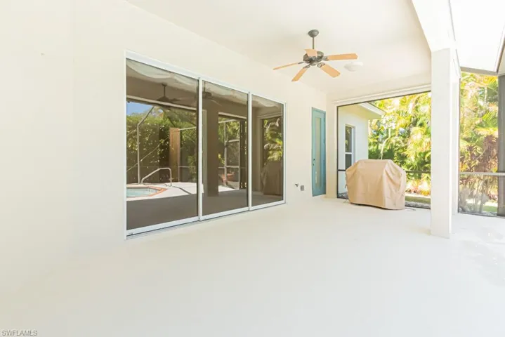 View of patio / terrace with a ceiling fan and a grill