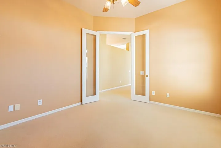 Den/office with French doors.  Could also be fourth bedroom.