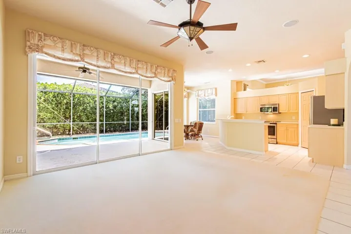 Family room featuring a sunroom, a ceiling fan, and recessed lighting