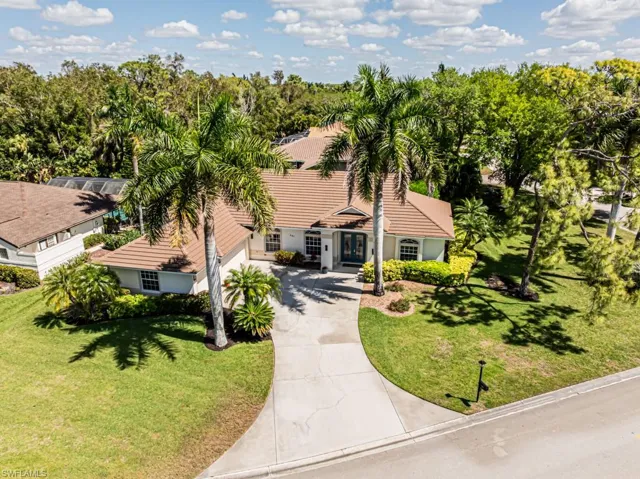 Aerial view of property and surrounding area, home is located on a quarter acre lot.