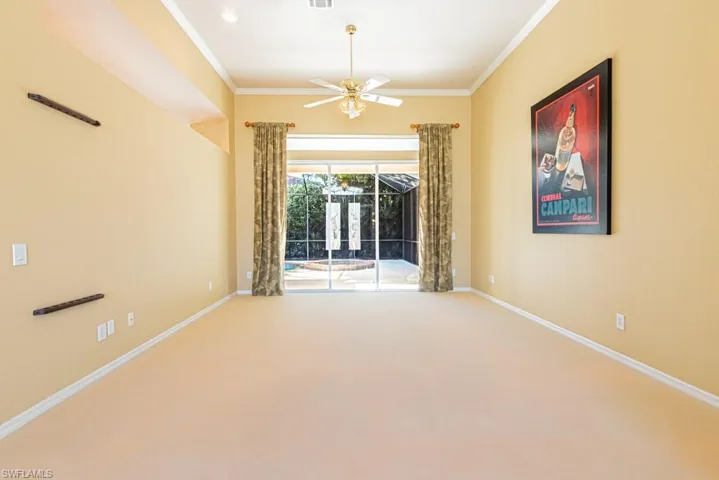 Main Living Room with glass sliders to pool.  Twelve-foot ceiling with crown molding.
