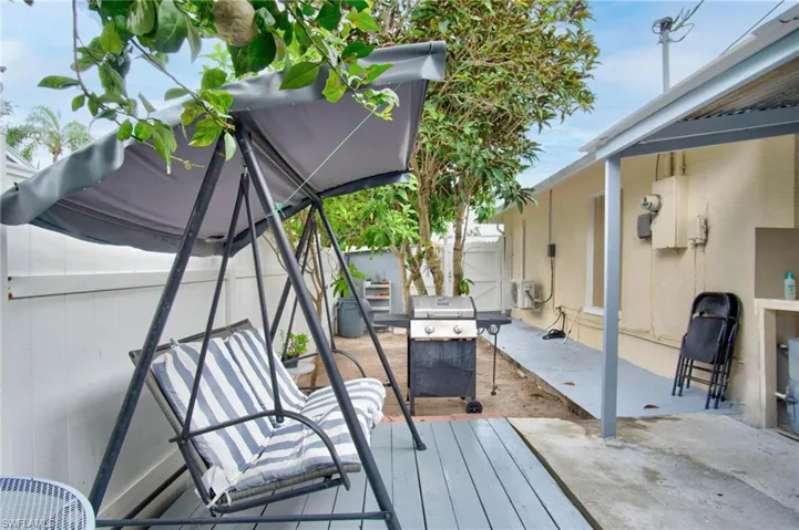 Deck featuring area for grilling and a patio area