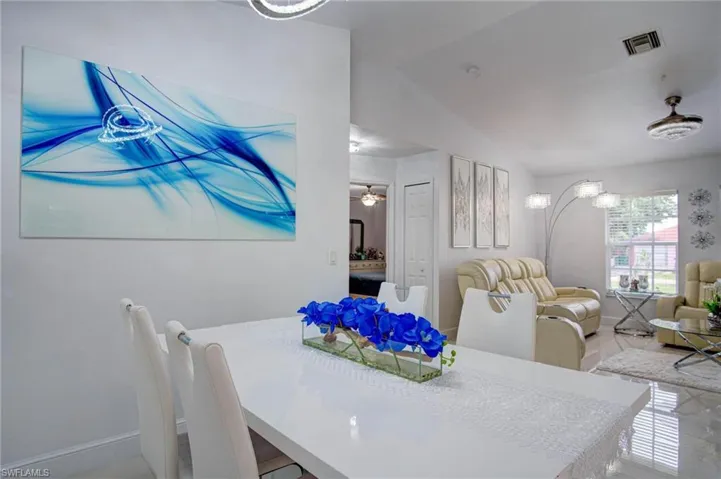 Dining space featuring vaulted ceiling and ceiling fan