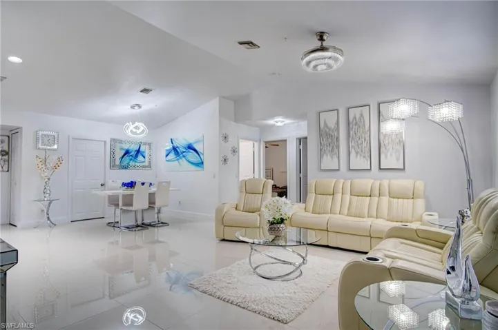 Living room featuring lofted ceiling