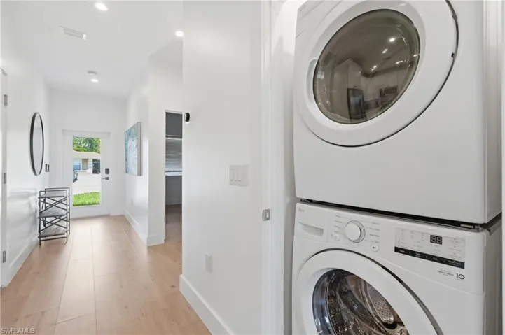 Entryway featuring wood-finish flooring, recessed lighting, and a full light front door