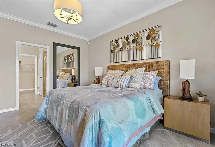 Neutral-toned walls complement crown molding and tile flooring