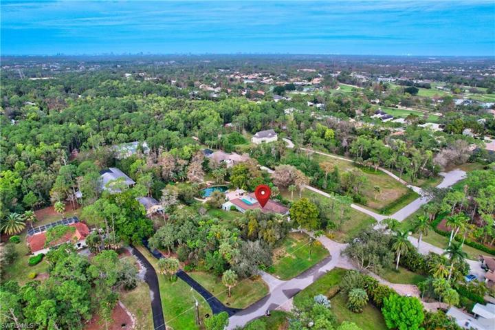 2.27 acres with main house, guest house, pavilion and lake