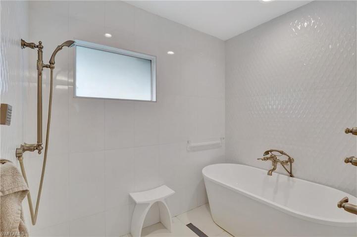 Primary shower room with tub