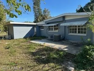 Rear view of property with a patio area and central AC